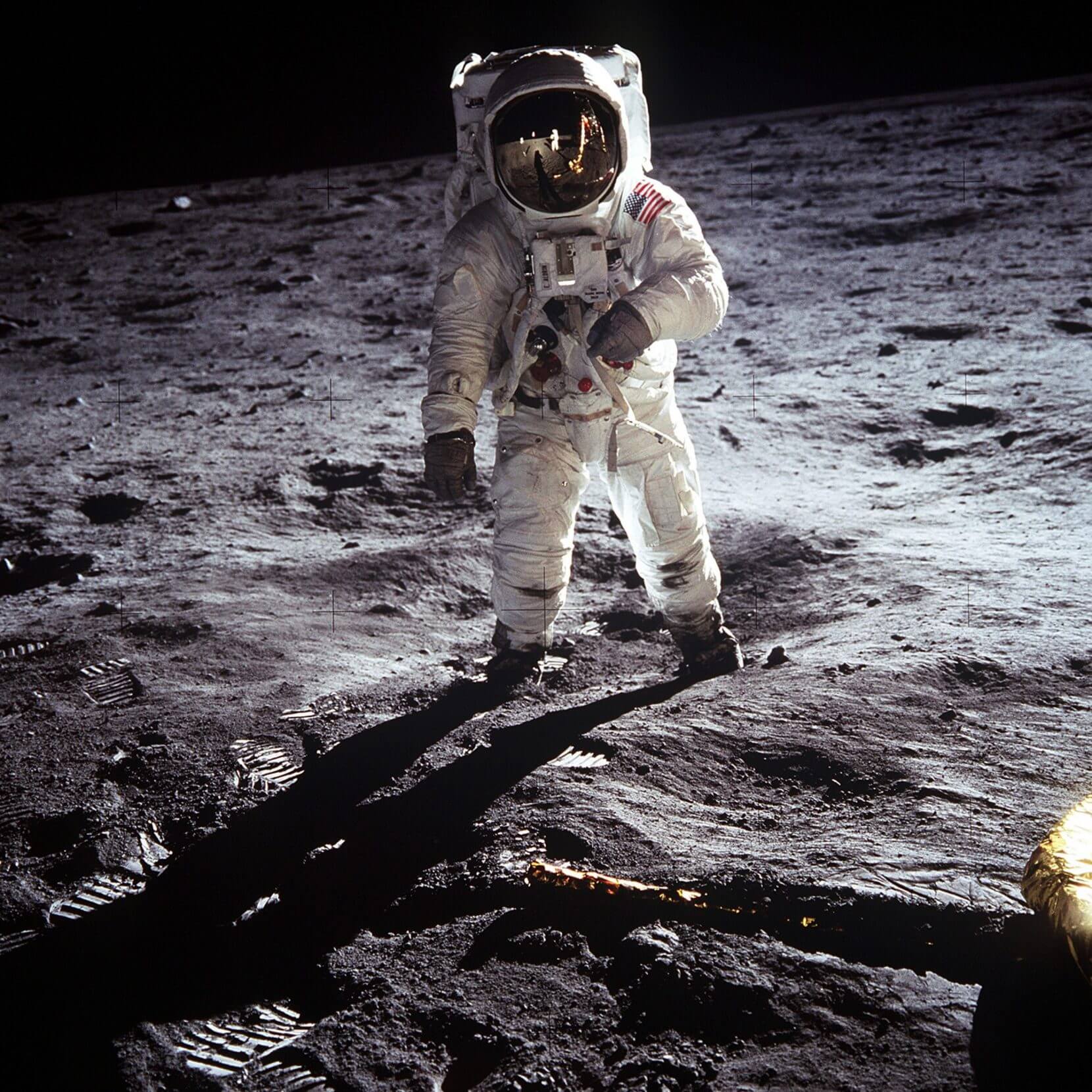 Astronaut Buzz Aldrin, lunar module pilot, walks on the surface of the Moon near the leg of the Lunar Module (LM) 