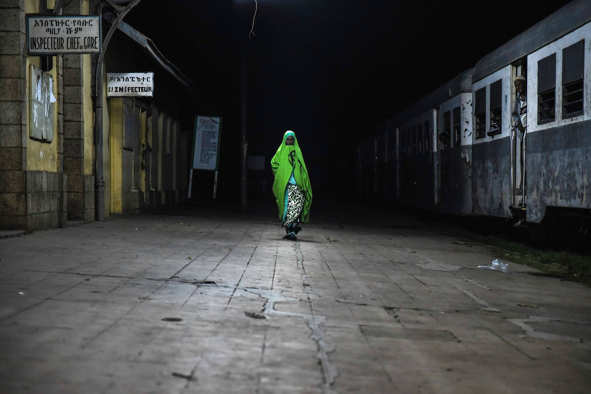 A Somali woman walks in Dire Dawa train station before the departure of the 