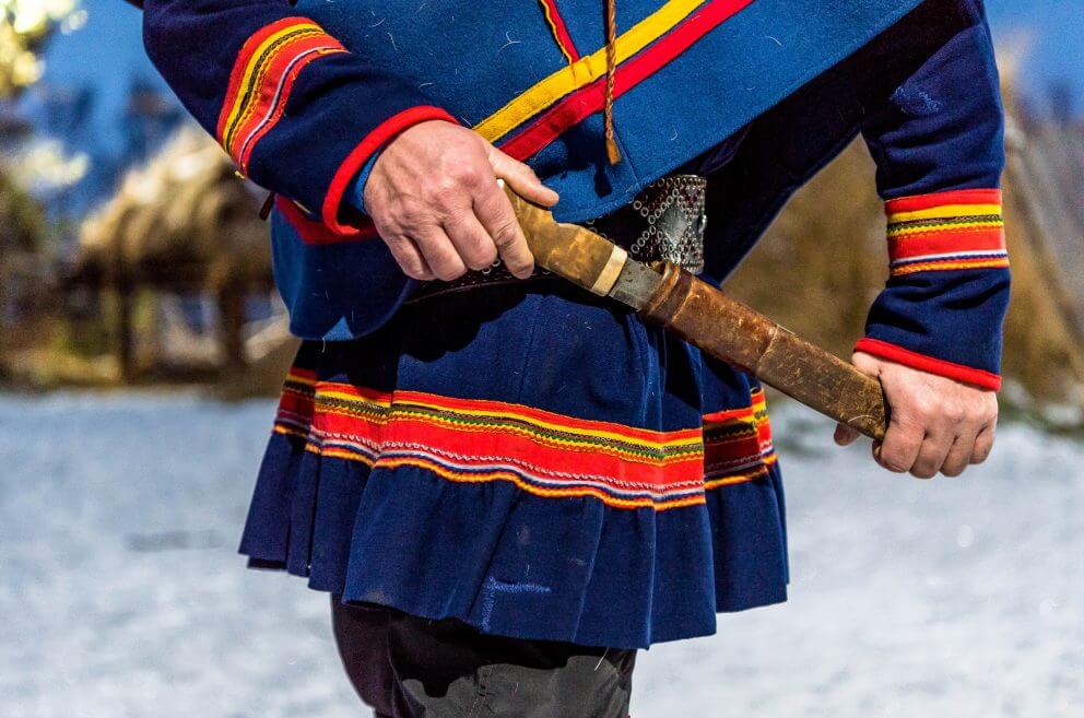 Sámi attire Sámi reindeer herder Nils Torbjörn Nutti brandishes a traditional knife — a tool with myriad uses in the Arctic wilderness — affixed to the belt of his gákti.