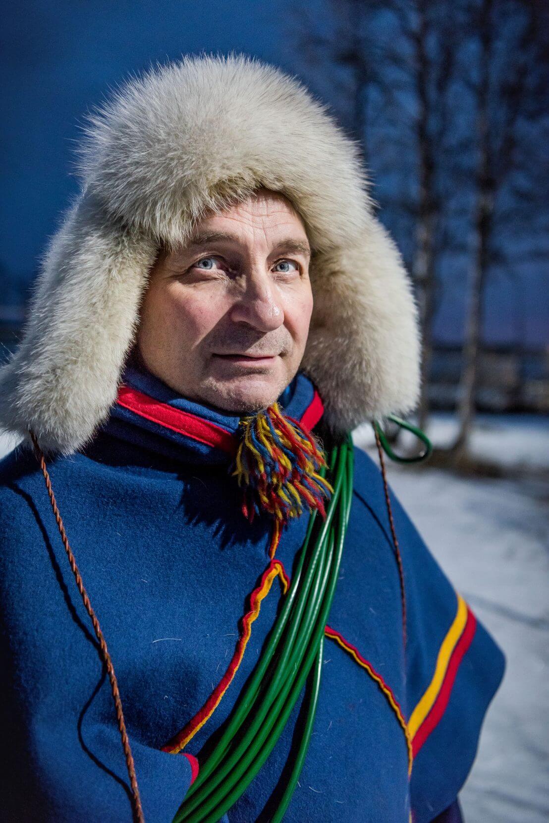 Sámi man To block the wind of northern Sweden, Sámi reindeer herder Nils Torbjörn Nutti wears a poncho-like luhkka on the job. His red and yellow stitching identify that he comes from the Karesuando region in northernmost Sweden.