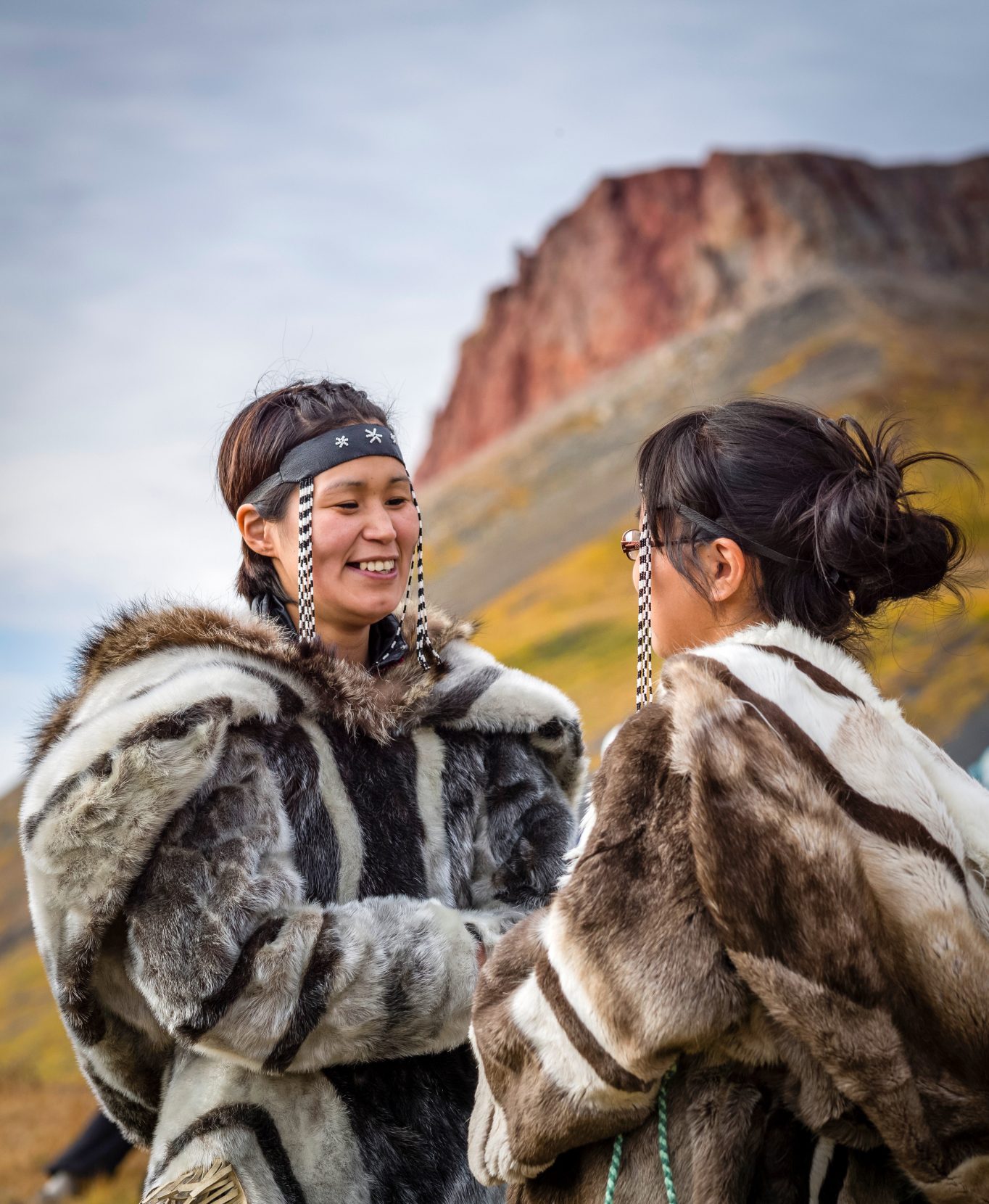 A pair of women on Arctic Canada’s Baffin Island carry on the Inuit tradition of throat-singing, a guttural vocal game in which singers face off to outlast the other — or provoke the other to laugh first. Photo: Albert Knapp/Alamy.