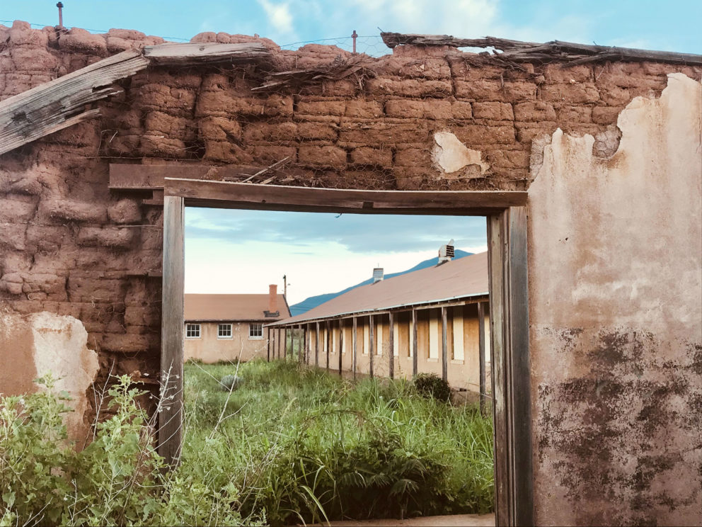 Construction of Camp Naco’s buildings began in 1919. Among the only Western camps made of adobe, the outpost has deteriorated in the face of vandalism, arson, and erosion. Photo: Lauren Napier.