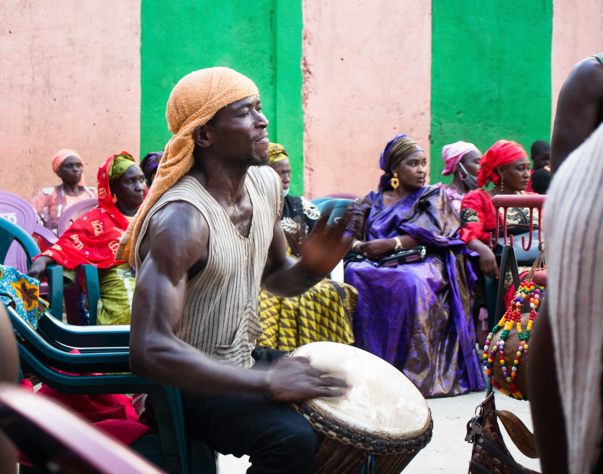 Drummer Mamoudou Keita plays the djembe at a traditional pre-wedding ceremony in Conakry, Guinea. His father performed as a soloist of Les Ballets Africains. Photo: Aki Natori.