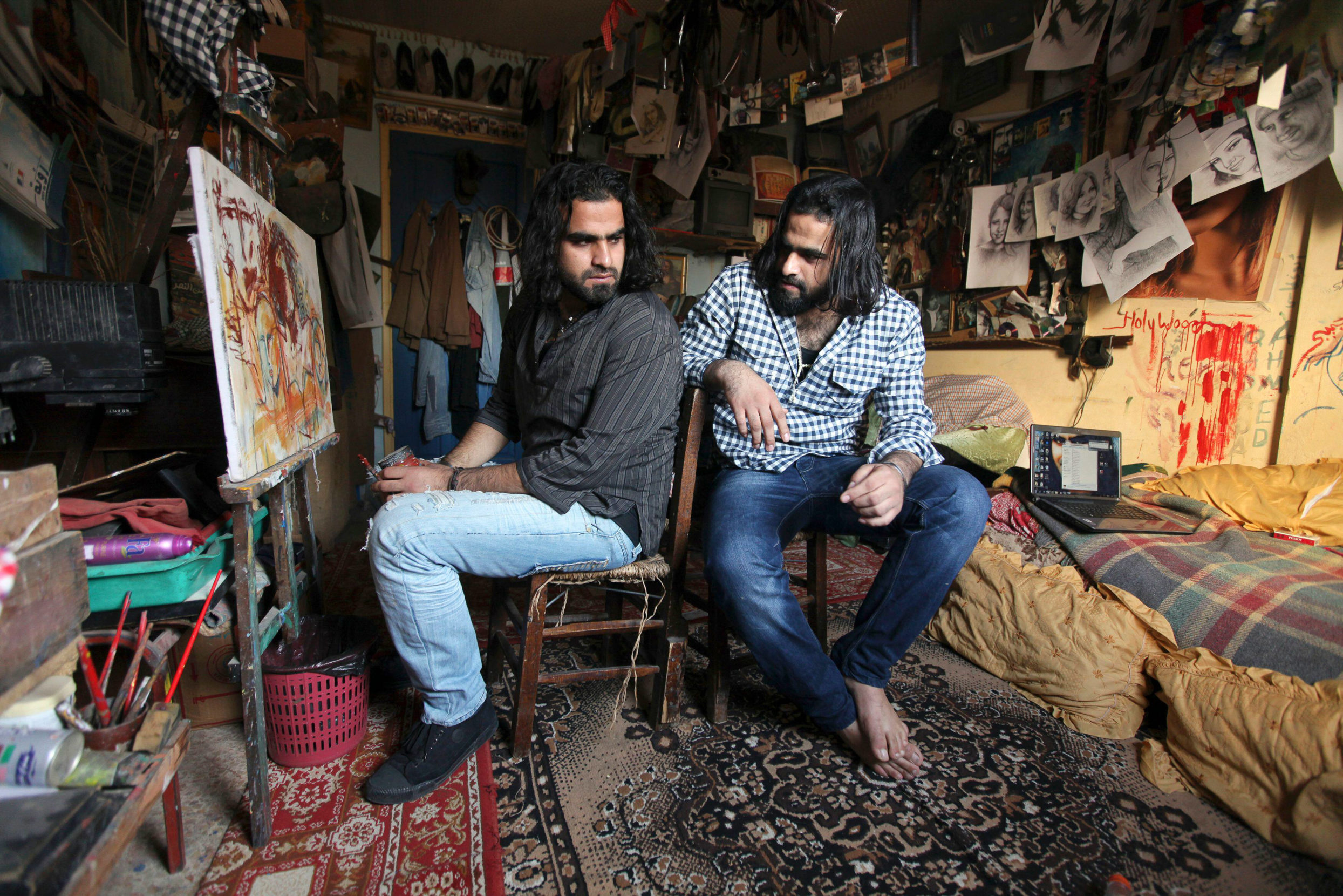 Twin brothers Ahmed and Mohamed Abu Nasser, better known as Tarzan and Arab, hold court in their Gazawood studio in 2010. Photo: Mohammed Salem/Reuters/Alamy.