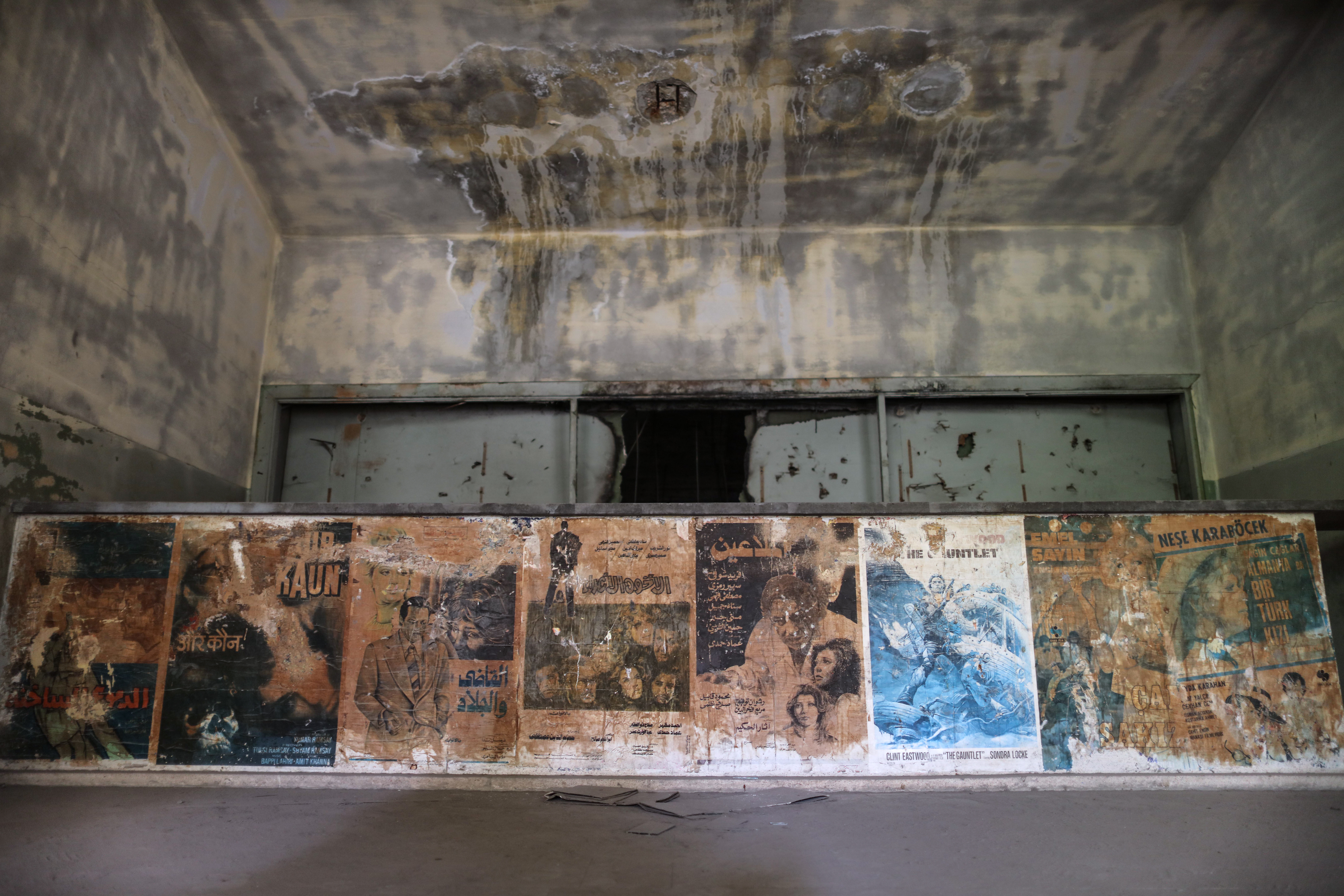 Faded film posters remain on the walls of Gaza City’s abandoned al-Nasr movie house. Photo: Xinhua/Alamy.