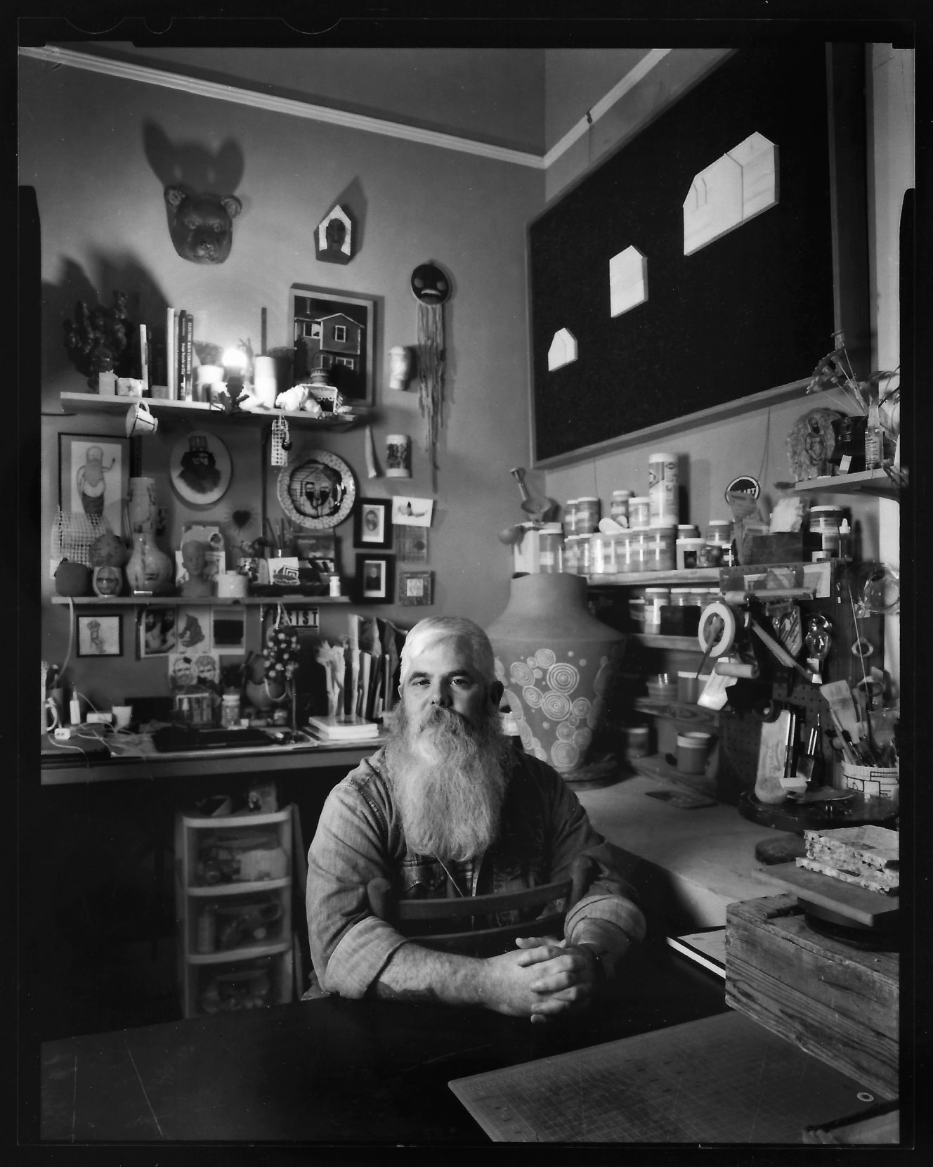Mark Errol sits in his backroom pottery studio — the seed that germinated into his Tifton art gallery, Plough, in 2014. Photo: Eric Dusenbery.
