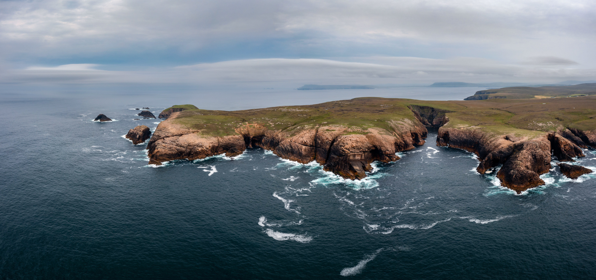 Panorama landscape of the cliffs and wild coast of northern Ireland.