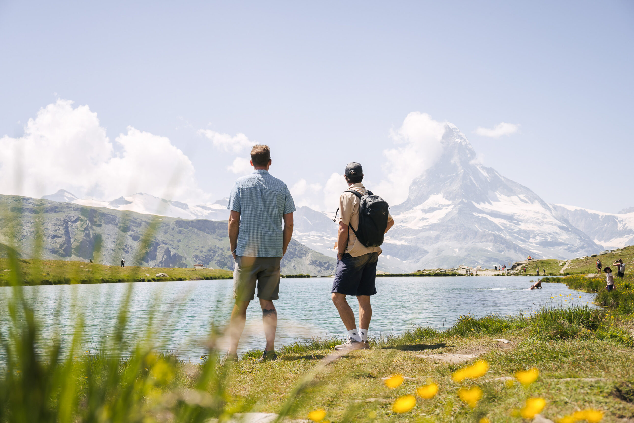 Two men looking out at the Matterhorn.