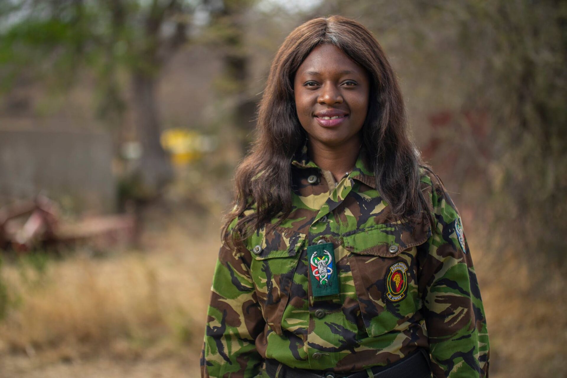 Portrait of a smiling Black woman in a ranger uniform.