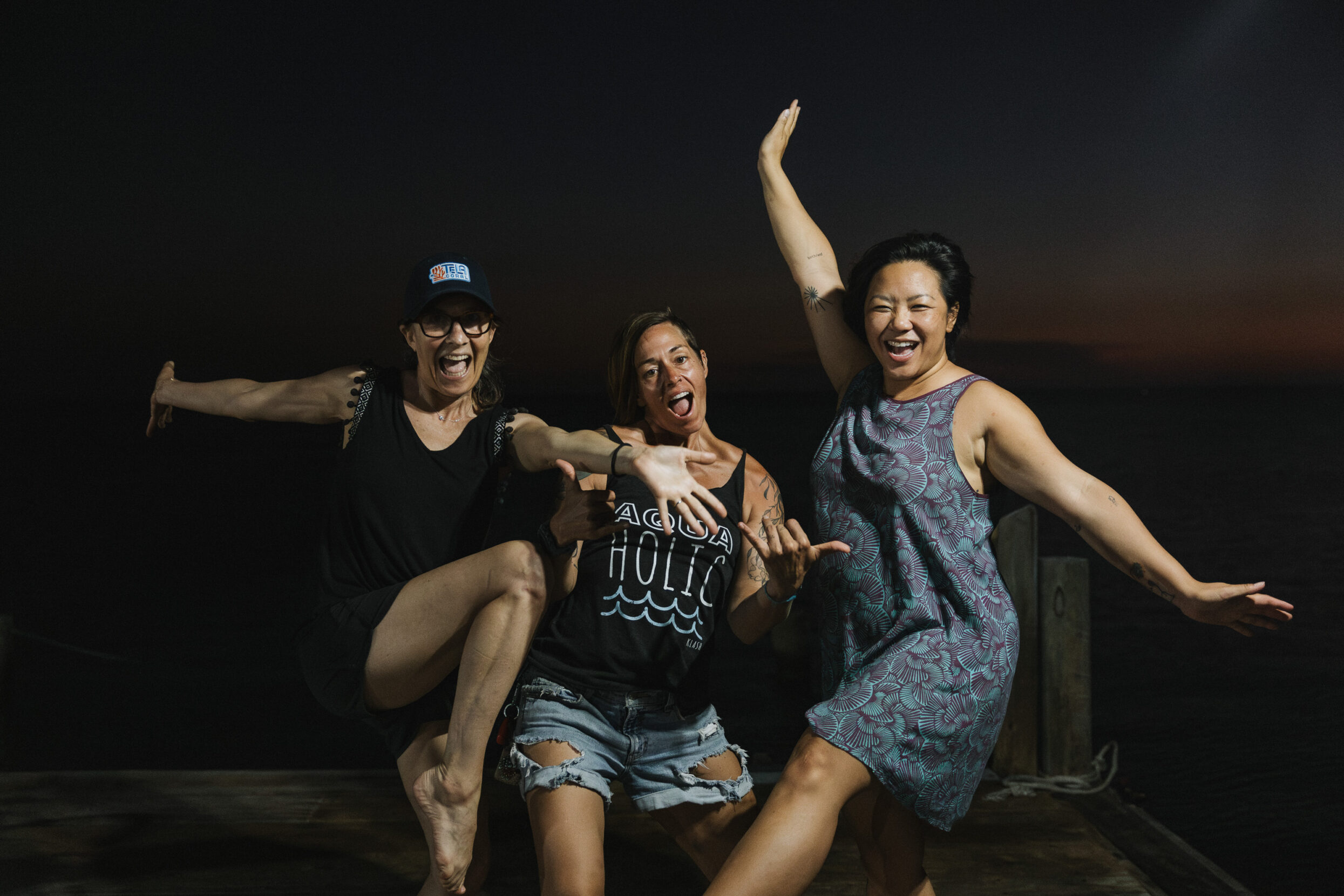 Three women posing excitedly for the camera